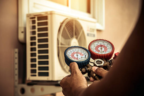 Professional Heat Pump Repair technician working in Tecumseh, MI